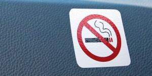 no smoking sign on car dashboard